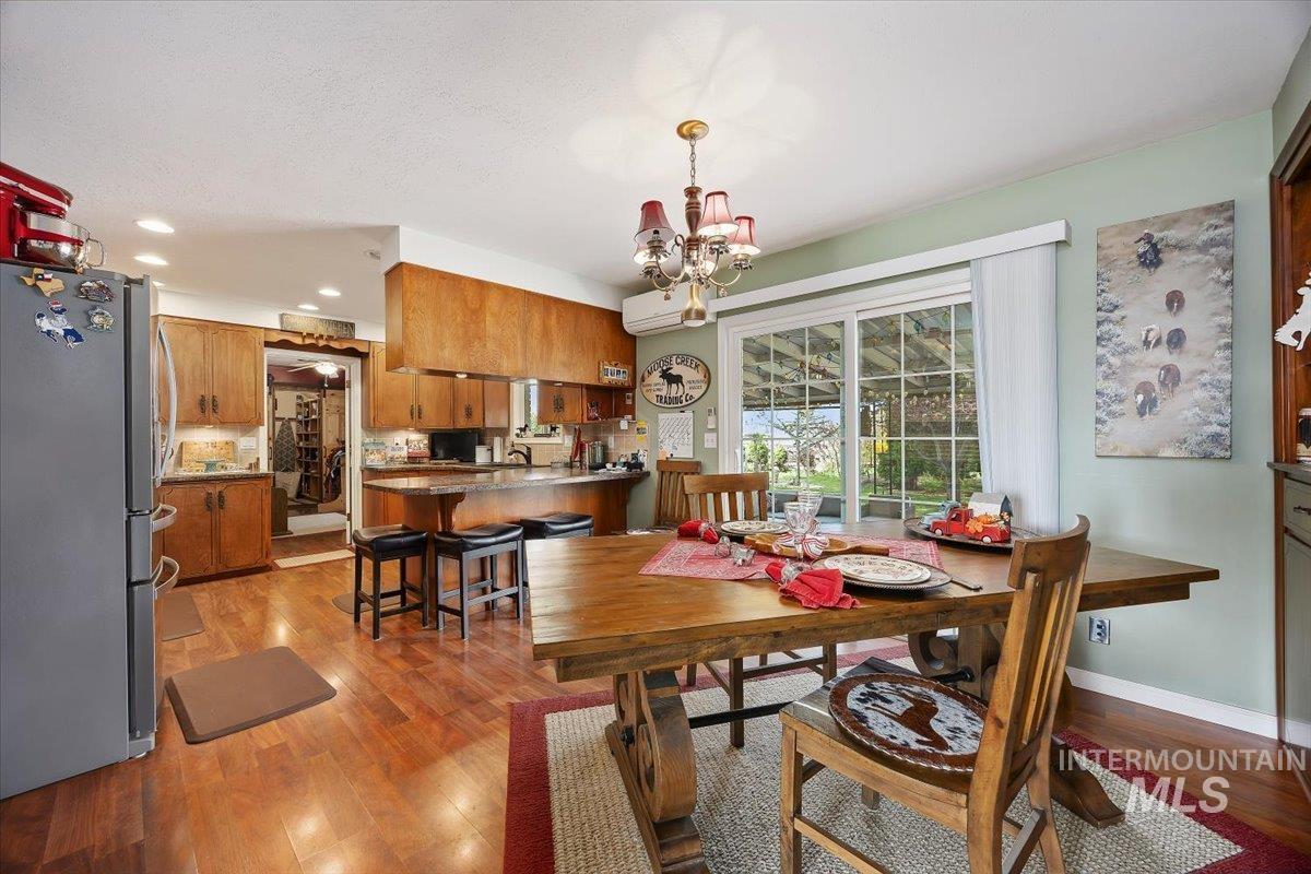 1301 A Street Rupert, ID 83350 - Photo 10 of 45 Dining room with light wood-style floors and suspended lighting