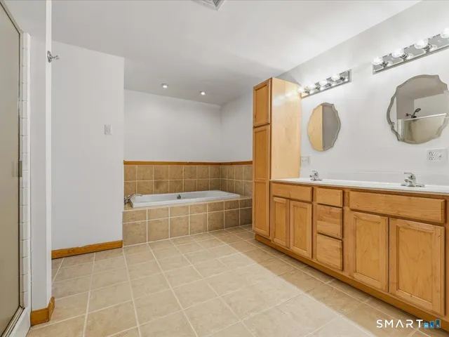 a view of a storage & utility room with a sink