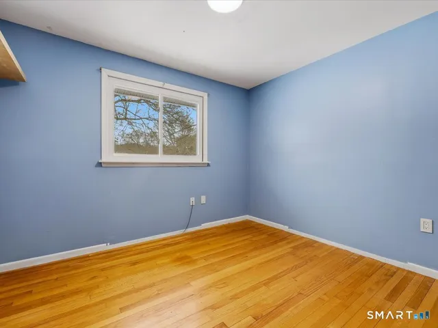a spacious bathroom with a granite countertop sink toilet and shower