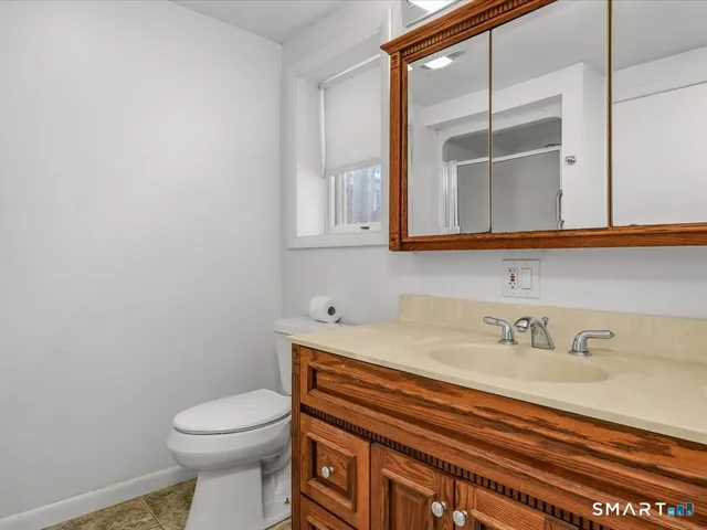 a kitchen with a sink a stove and cabinets