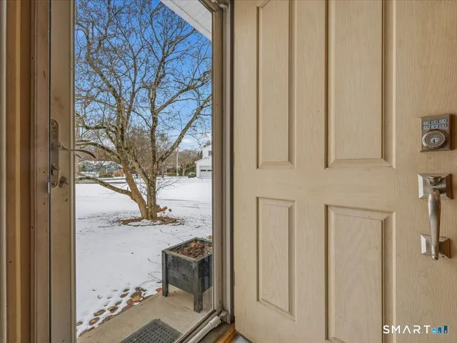 a view of a house with snow on the wall