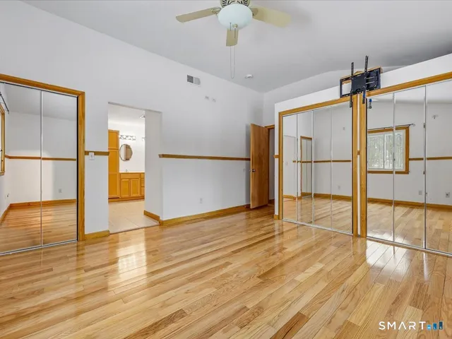 a bathroom with a bathtub a sink and a mirror