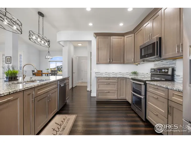 a room with lots of clutter and cabinets