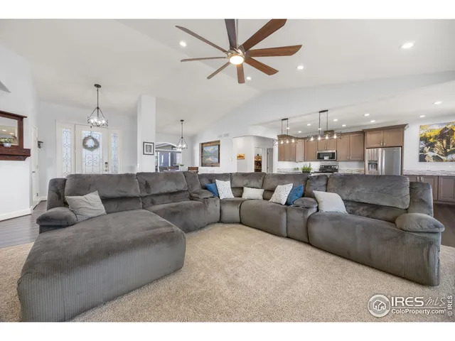 a spacious bathroom with a granite countertop sink mirror and a bathtub
