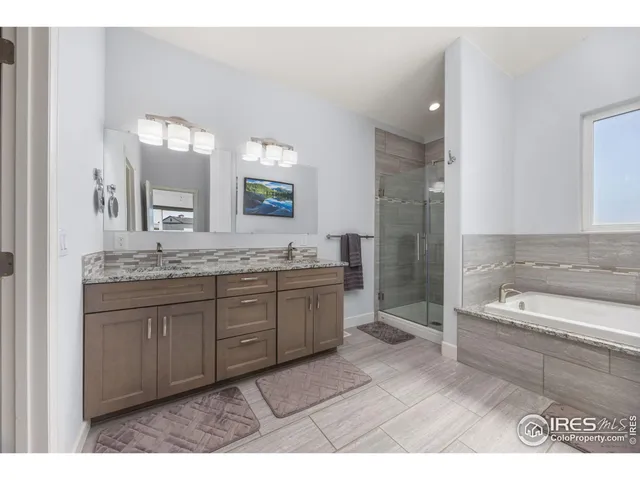 a view of livingroom with furniture and chandelier fan