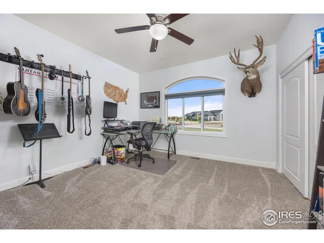 a view of swimming pool with outdoor seating