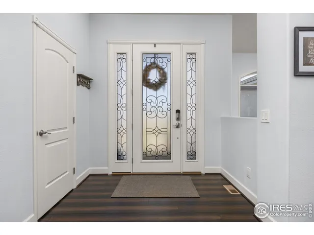 a view of a dining room with furniture wooden floor and a chandelier