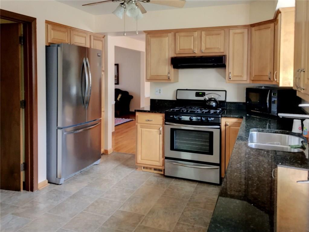 508 Kerrwood Road Pittsburgh, PA 15215 - Photo 2 of 18 MAPLE KITCHEN WITH GRANITE COUNTERTOPS, AMPLE CABINETRY AND STAINLESS STEEL APPLIANCES