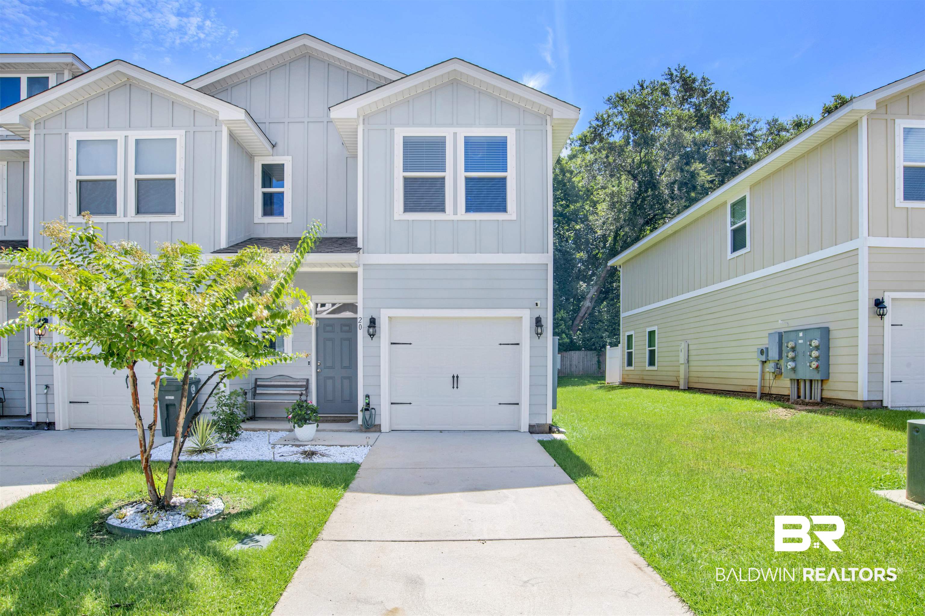 25806 Pollard Road, Unit 20 Daphne, AL 36526 - Photo 1 of 29 View of front of property with a garage and a front yard