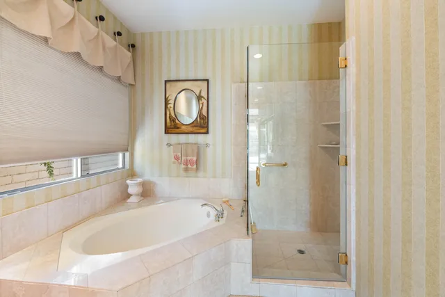 a bathroom with a bathtub and a shower