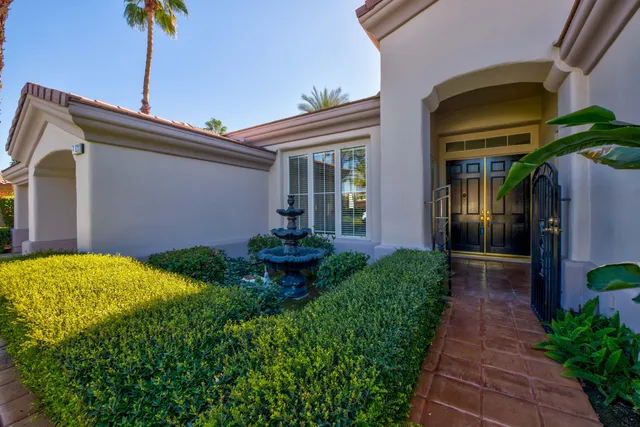a front view of house and yard with green space