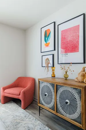 a bedroom with furniture and painting on the wall