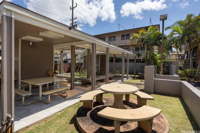 a view of a patio with couches table and chairs