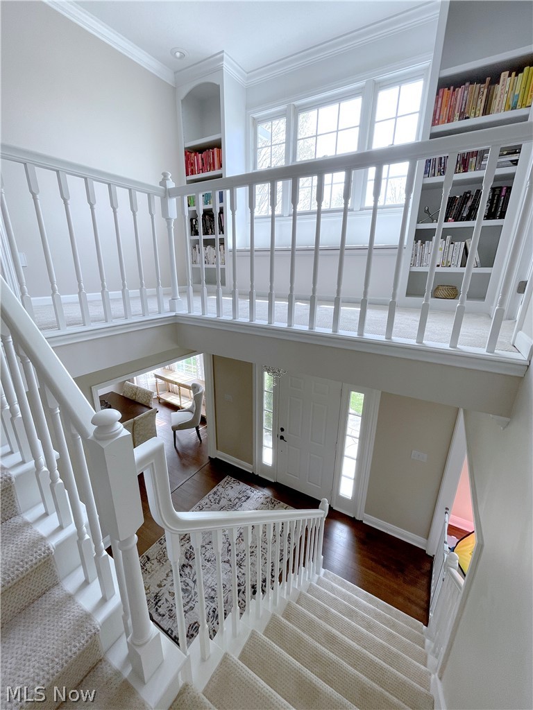 718 Sunridge Road Fairlawn, OH 44333 - Photo 25 of 49 Stairway with ornamental molding, built in shelves, and a towering ceiling