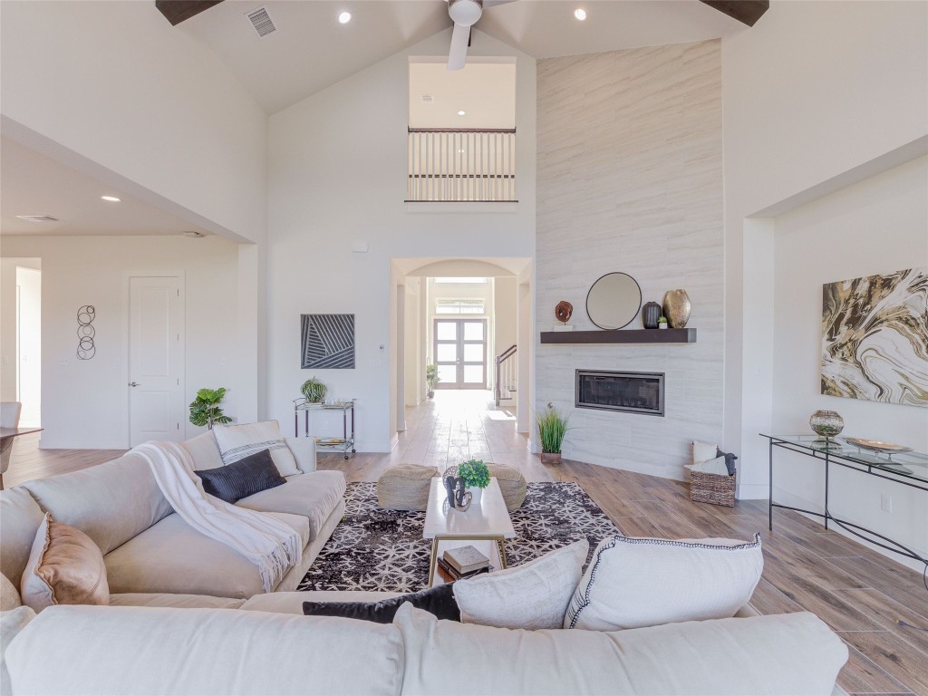 345 Two Creeks Lane Austin, TX 78737 - Photo 12 of 40 a living room with furniture and a fireplace