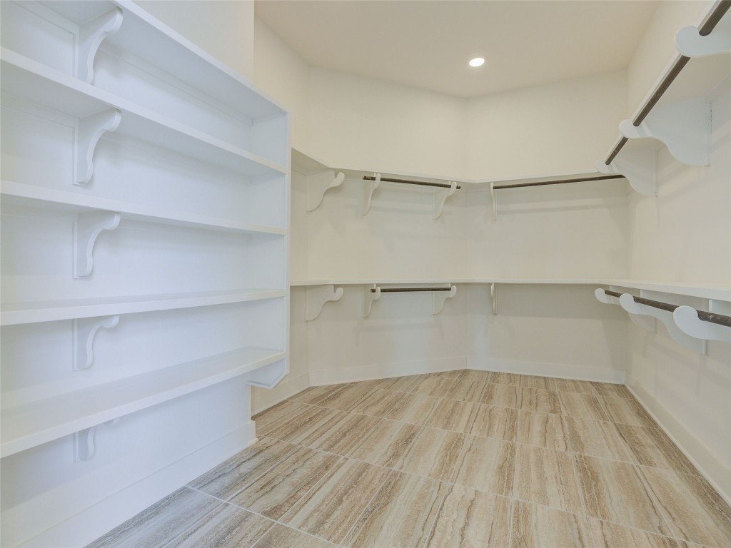 345 Two Creeks Lane Austin, TX 78737 - Photo 23 of 40 a view of walk in closet with empty racks
