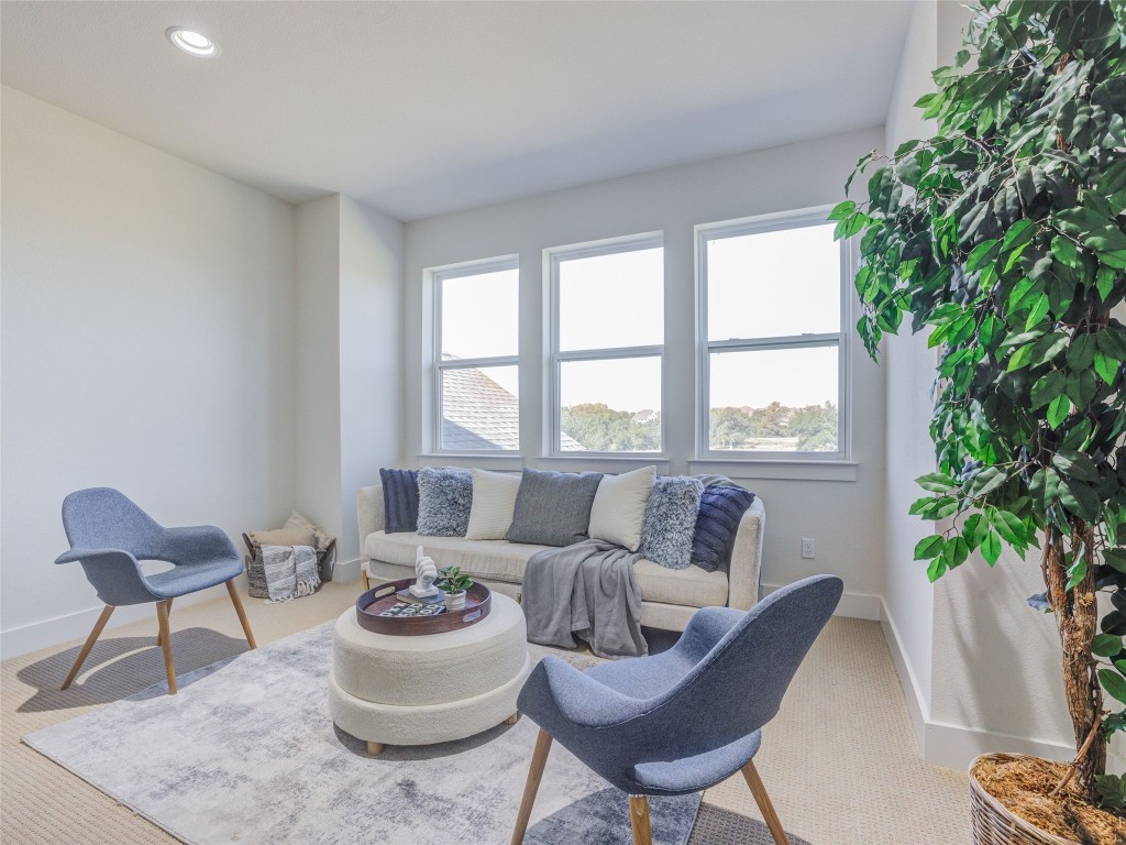 345 Two Creeks Lane Austin, TX 78737 - Photo 27 of 40 a living room with furniture and a large window