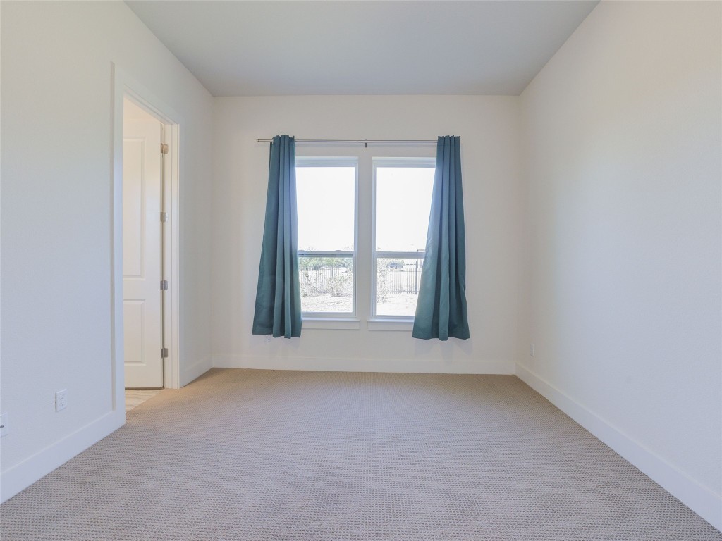 345 Two Creeks Lane Austin, TX 78737 - Photo 31 of 40 an empty room with windows