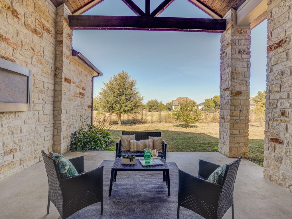 345 Two Creeks Lane Austin, TX 78737 - Photo 35 of 40 a balcony with furniture and a potted plant
