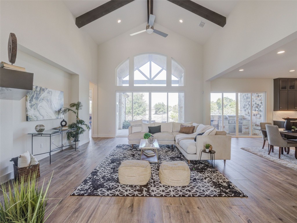 345 Two Creeks Lane Austin, TX 78737 - Photo 4 of 40 a living room with furniture large window and wooden floor