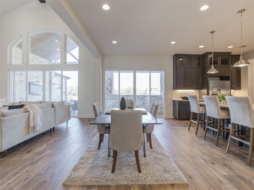 345 Two Creeks Lane Austin, TX 78737 - Photo 5 of 40 a dining room with furniture window and wooden floor
