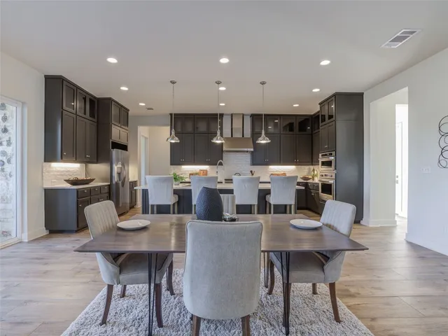 a view of a dining room with furniture