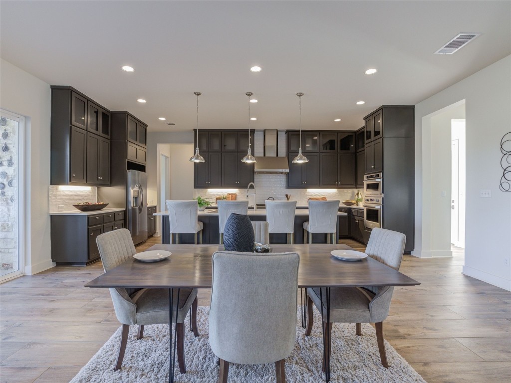 345 Two Creeks Lane Austin, TX 78737 - Photo 6 of 40 a view of a dining room with furniture