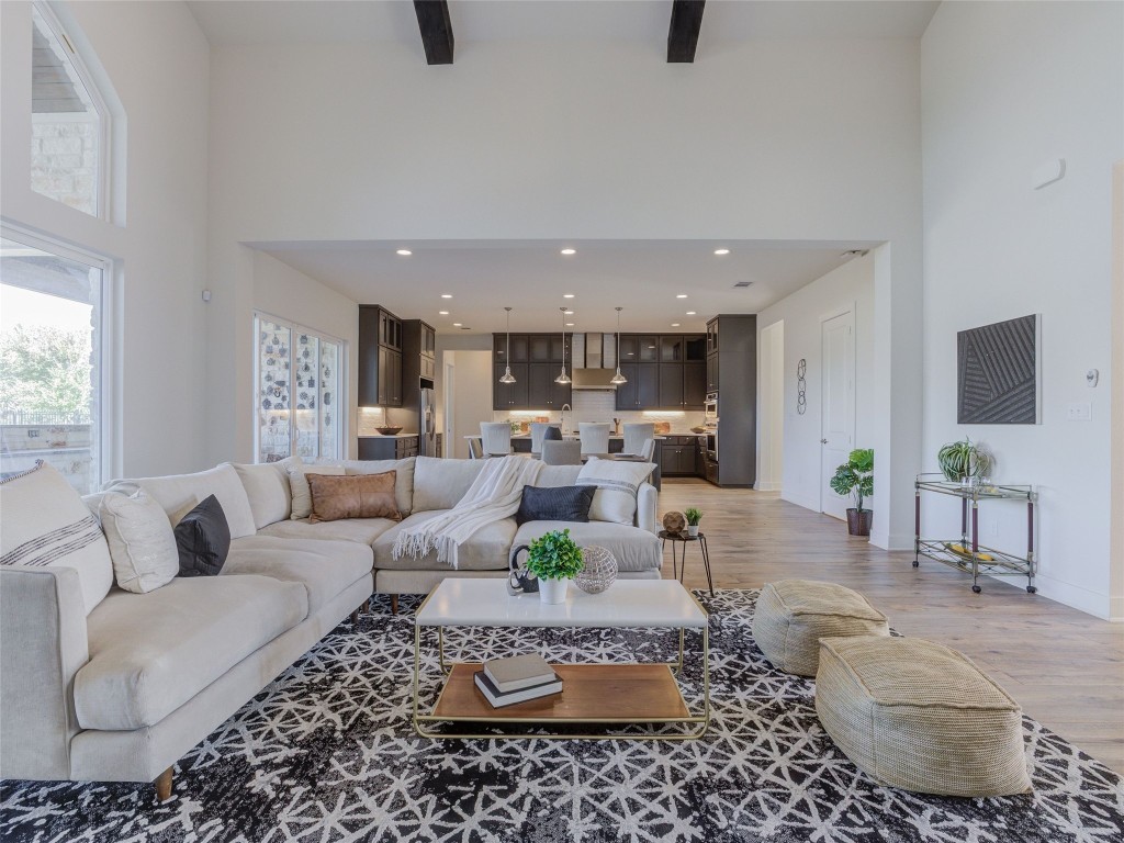 345 Two Creeks Lane Austin, TX 78737 - Photo 10 of 40 a living room with furniture and a table