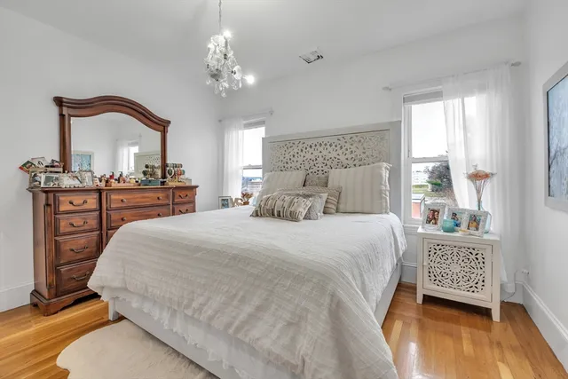 a bedroom with a bed and a dresser