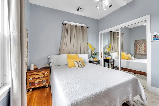 a bedroom with a bed and a cabinets