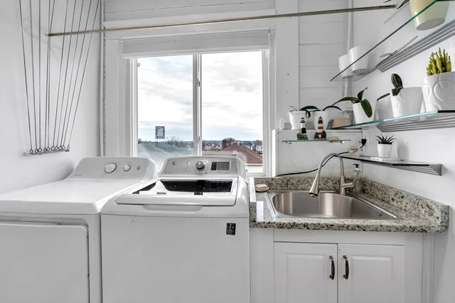 a kitchen that has a sink and a stove