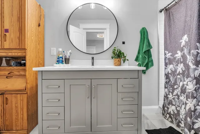 a bathroom with a sink and a mirror