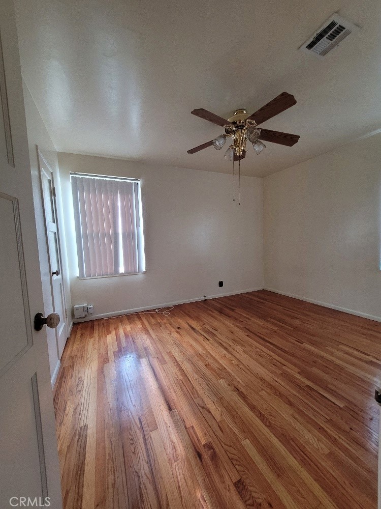 14030 Dittmar Drive Whittier, CA 90605 - Photo 15 of 32 wooden floor in an empty room with a window