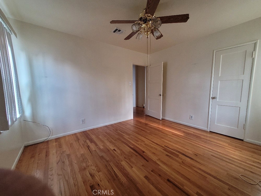 14030 Dittmar Drive Whittier, CA 90605 - Photo 16 of 32 a view of empty room with wooden floor and ceiling fan