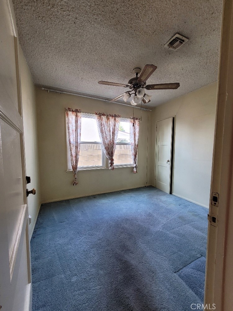14030 Dittmar Drive Whittier, CA 90605 - Photo 18 of 32 an empty room with windows and fan