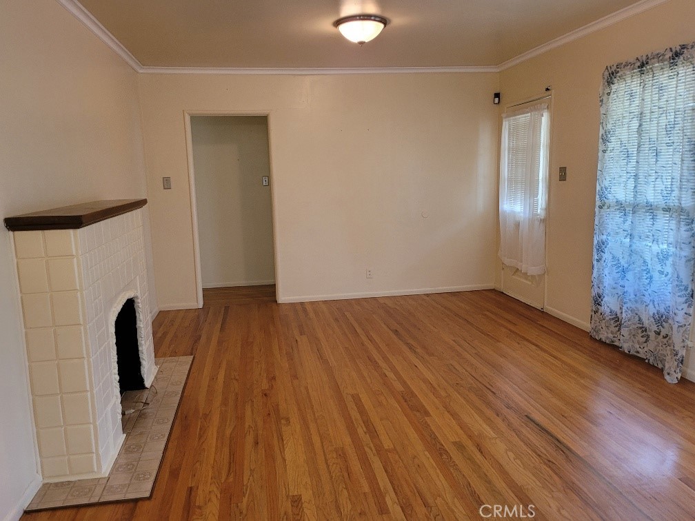 14030 Dittmar Drive Whittier, CA 90605 - Photo 6 of 32 a view of empty room with wooden floor and fan