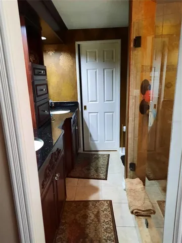 a bathroom with a tub and shower