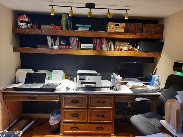 a view of workspace with cabinets