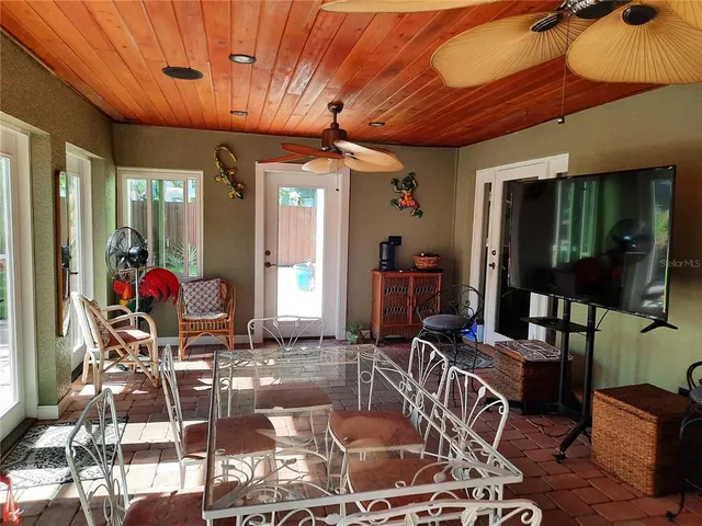 a dining room with furniture and a chandelier