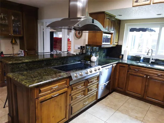 a kitchen with a stove and a sink