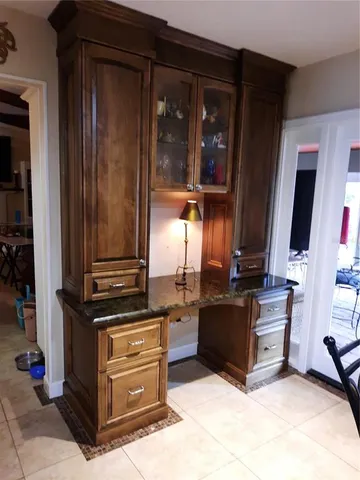 a view of living room kitchen and utility room