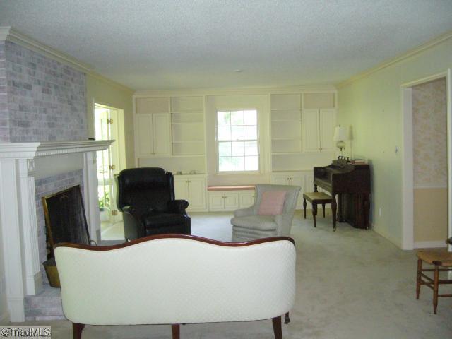 4500 Oakcliffe Road Greensboro, NC 27406 - Photo 6 of 11 Living Room. Large, flexible space with beautiful built-in bookshelves and window seat at far end!