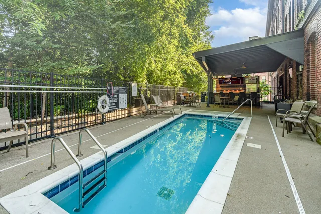 a view of a swimming pool with a patio