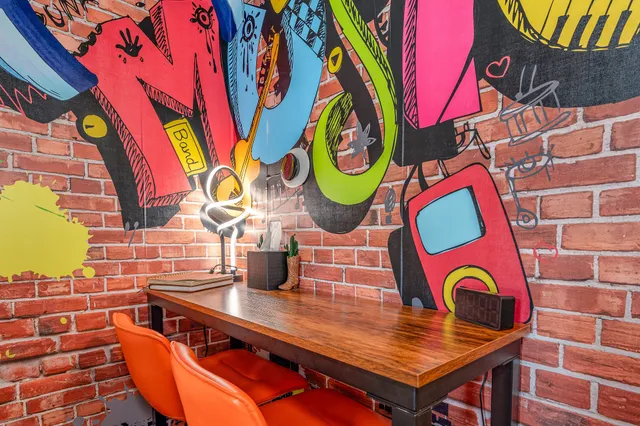 a room with chairs and wooden floor