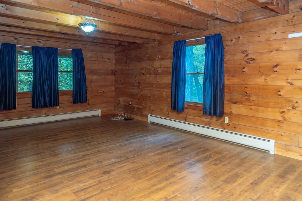 119 Long Plain Road Leverett, MA 01054 - Photo 23 of 38 a view of a house with a small backyard