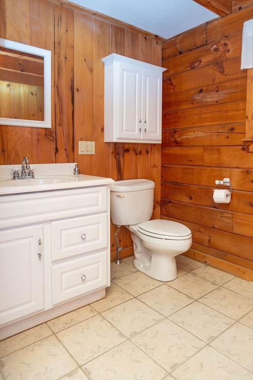 119 Long Plain Road Leverett, MA 01054 - Photo 28 of 38 a bathroom with a toilet a sink and mirror