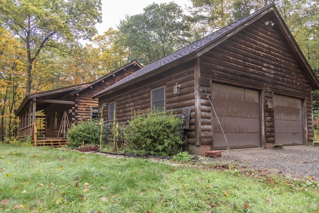 119 Long Plain Road Leverett, MA 01054 - Photo 3 of 38 a backyard of a house with plants and large tree