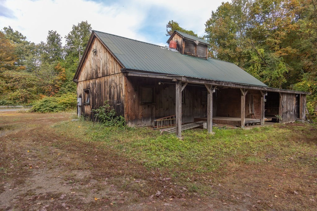 119 Long Plain Road Leverett, MA 01054 - Photo 9 of 38 a view of a house with a yard and large tree