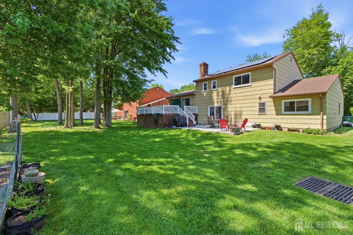 213 Normandy Road Edison, NJ 08820 - Photo 41 of 45 a front view of house with yard and green space