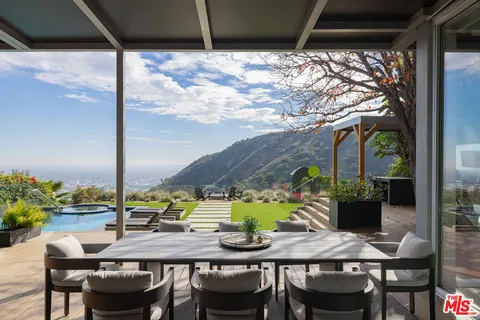 a view of an outdoor space with furniture
